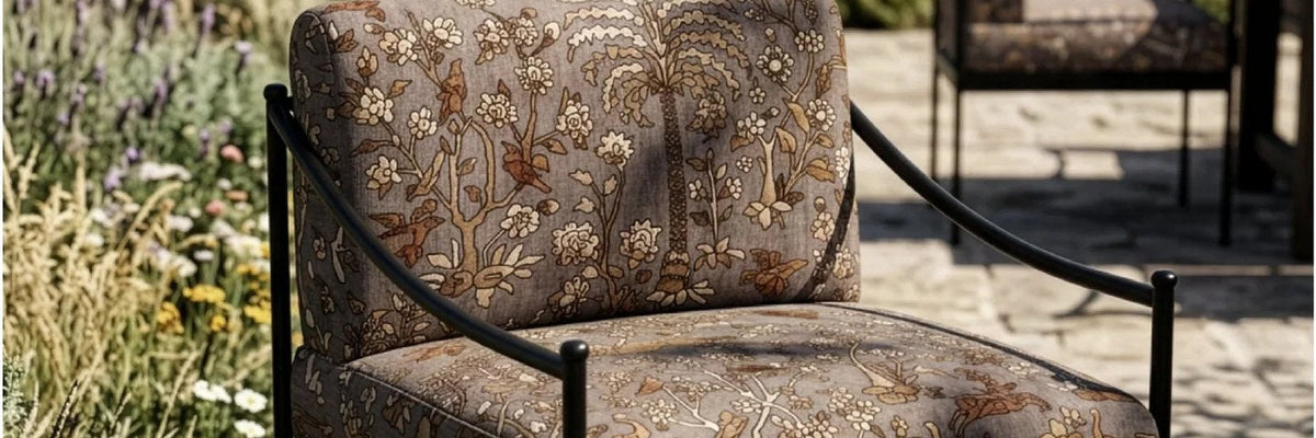 Mighty Jungle outdoor fabric in Autumn by The Vale London on a terrace armchair