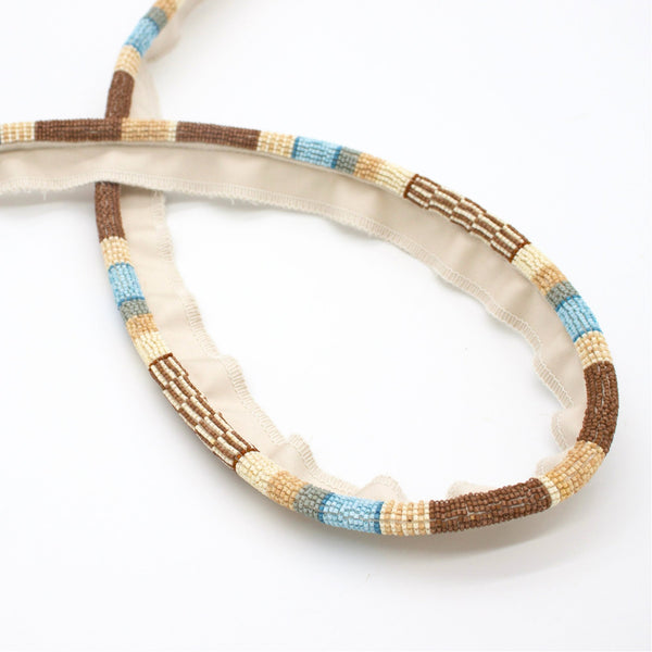 #hazelbrook Ferox beaded cord trim in Hazel Brook, looped to show the pattern repeat