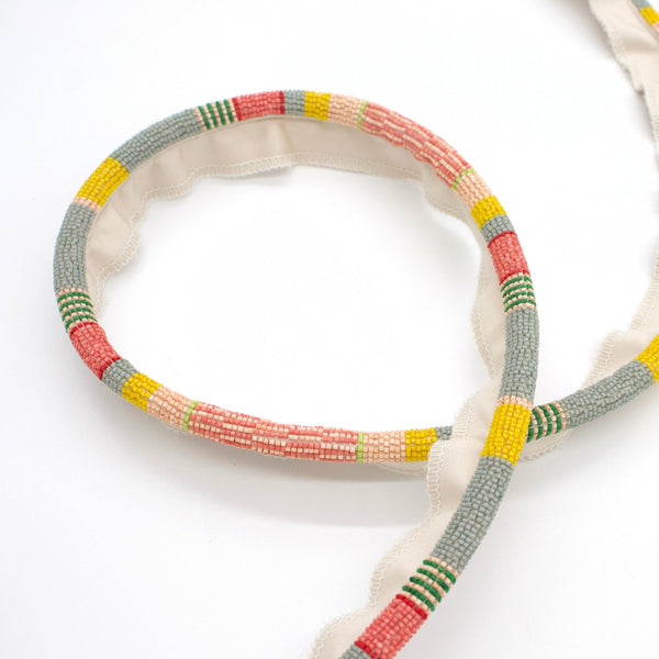 #pixiedust Ferox beaded cord trim in Pixie Dust, looped to show the pattern repeat