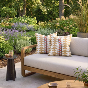 #dune Menkaure outdoor fabric in Dune, made up as cushions on a garden sofa