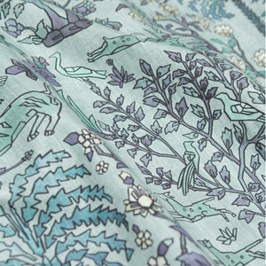 #lagune Mighty Jungle outdoor fabric in Lagune, draped to show the print in close detail