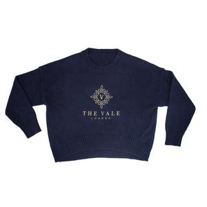 Embroidered Crewneck Sweater in navy organic cotton with gold logo embroidery, shown flat on a white background