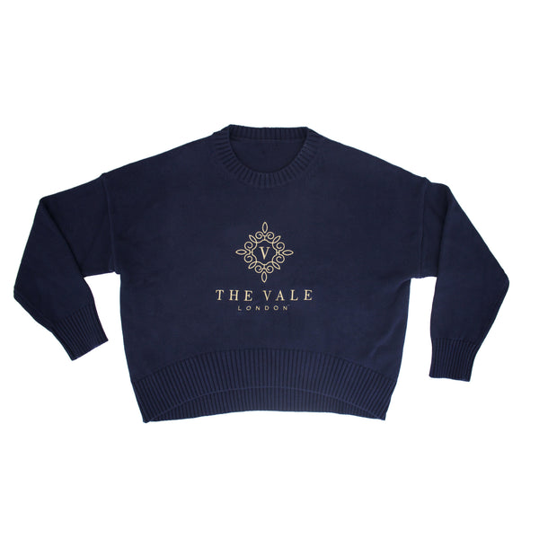 Embroidered Crewneck Sweater in navy organic cotton with gold logo embroidery, shown flat on a white background