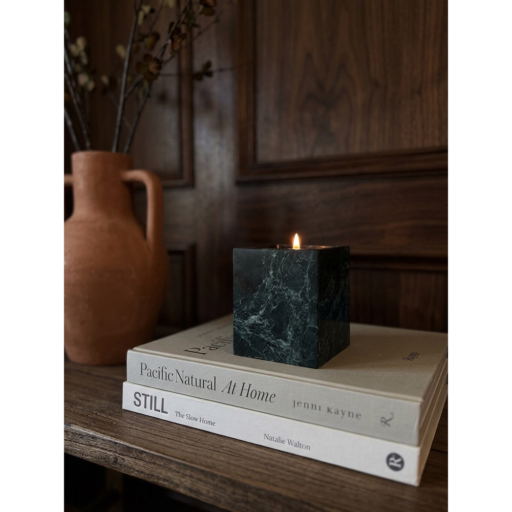 Jade Candle in a natural green marble vessel, shown against a white background