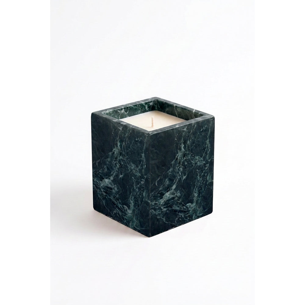 Jade Candle in a natural green marble vessel, shown against a white background