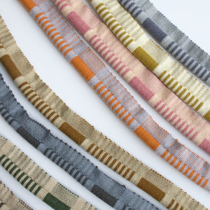 #all Close detail of Linea ribbed wool cord trim, showing the woven stripe in eight colourways