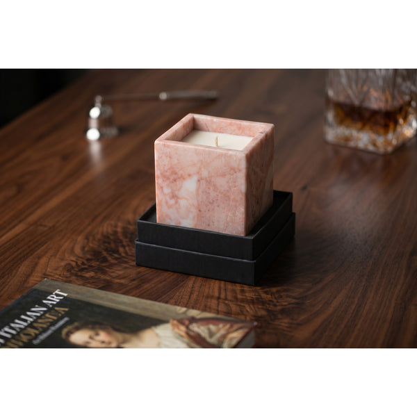 Rose Quartz Candle styled on a walnut desk with a cut-crystal glass and art book